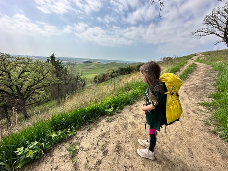 One of Amy's daughters takes a break along the trail