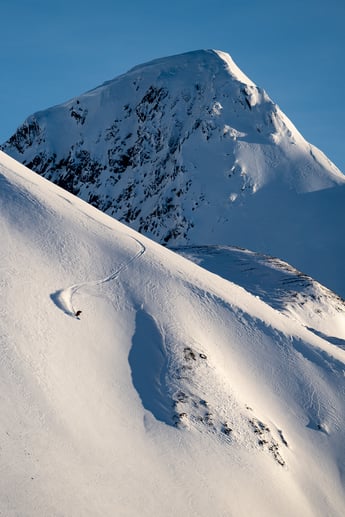 Anna skis down a spine