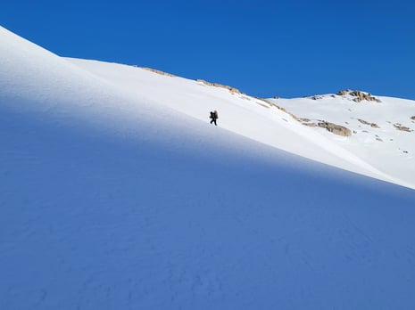 Backpacker in snow