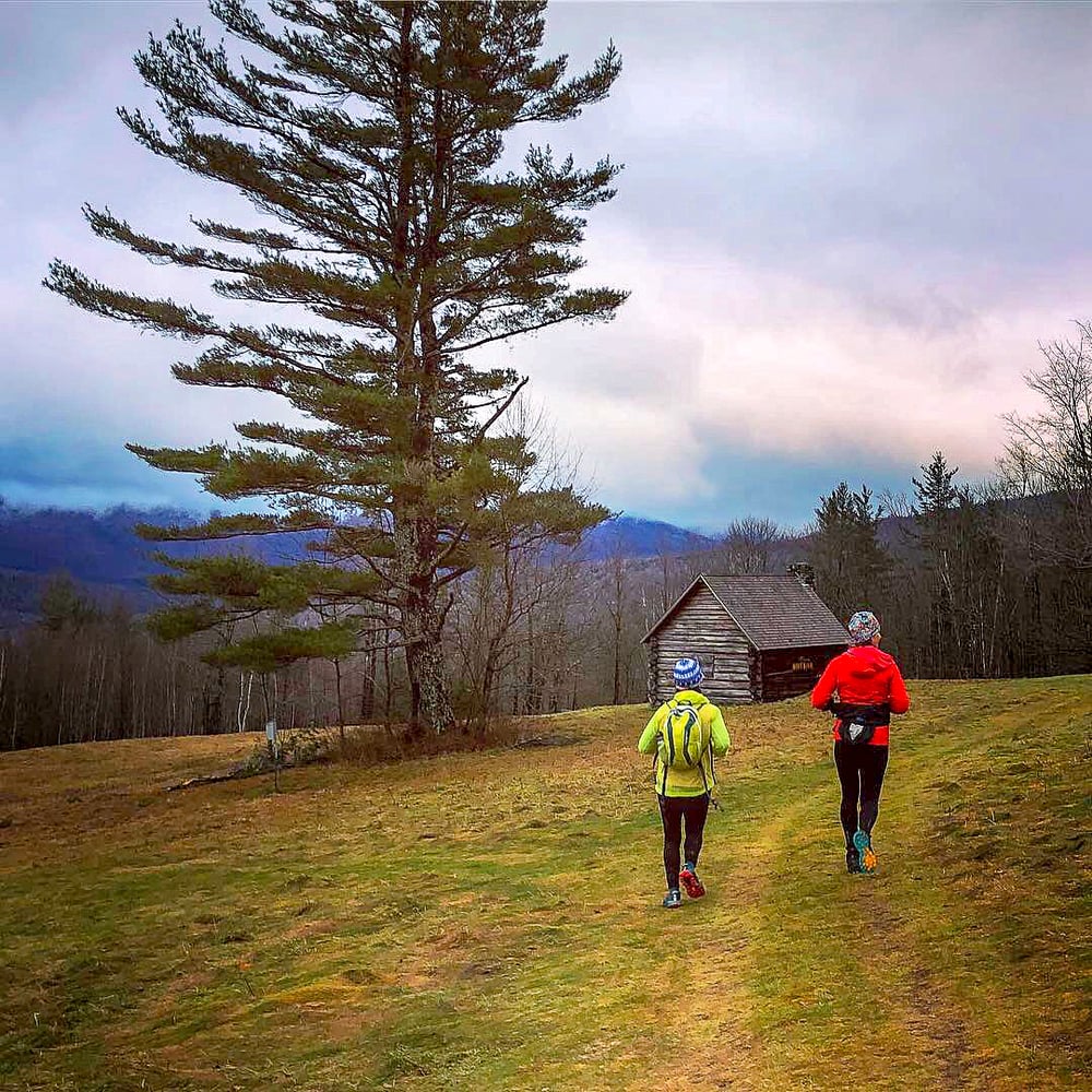 Trail running in a field in the evening